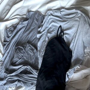 4 pack. Random tops. 2 grey short sleeve, 1 grey long sleeve. Black tank. Comfy